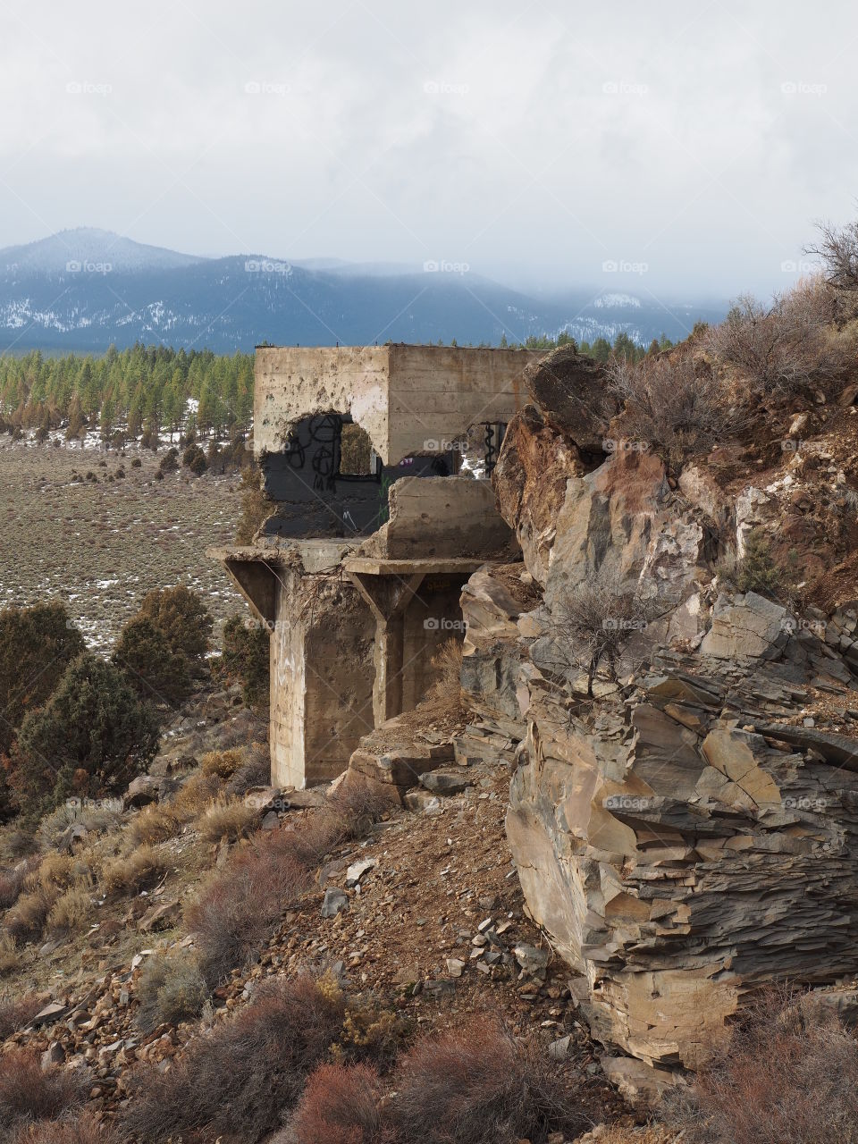 Old and crumbling tower on the Tumalo Reservoir Dam in Central Oregon on a winter day. 