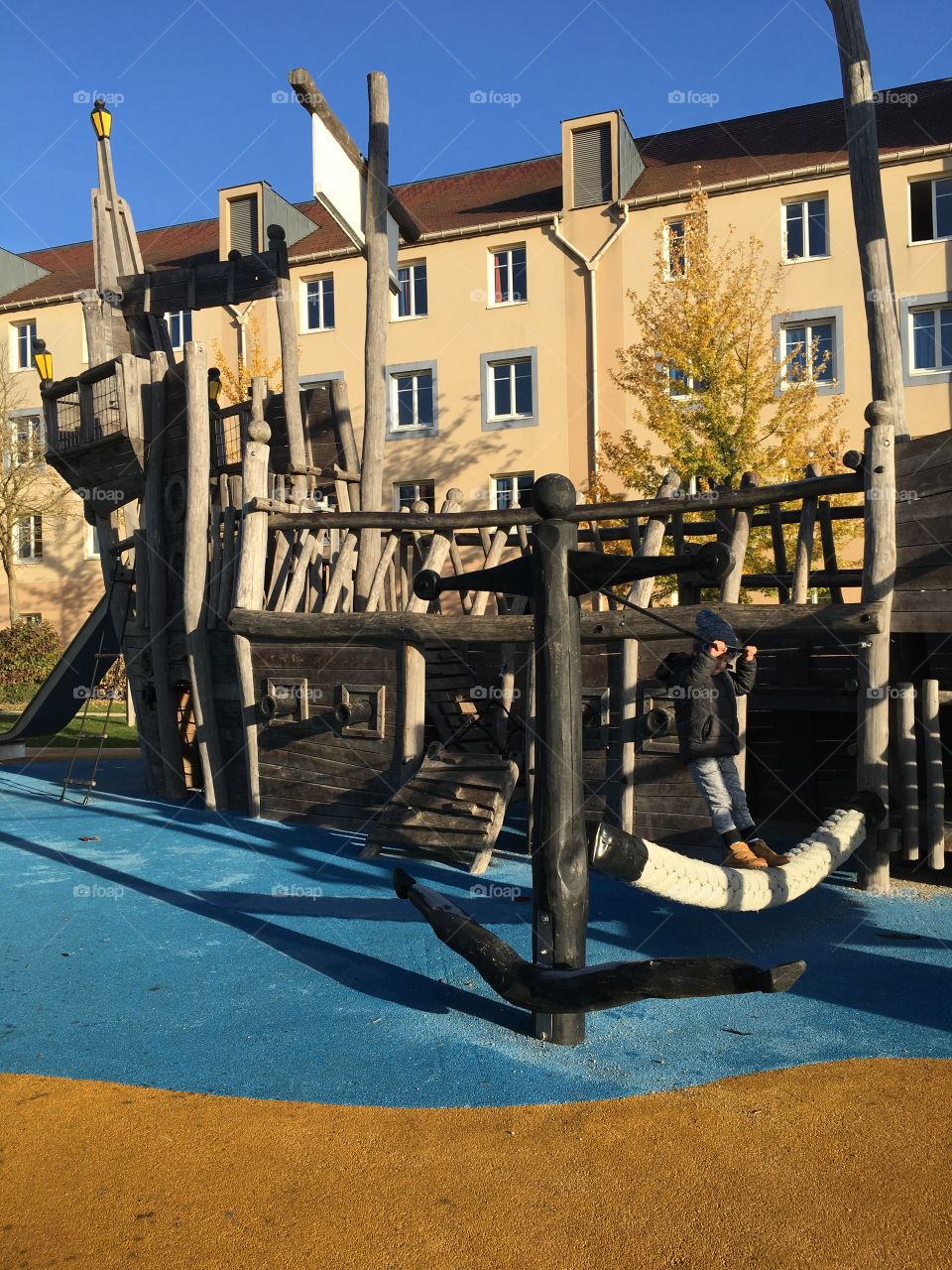 Kids playing on a wooden boat