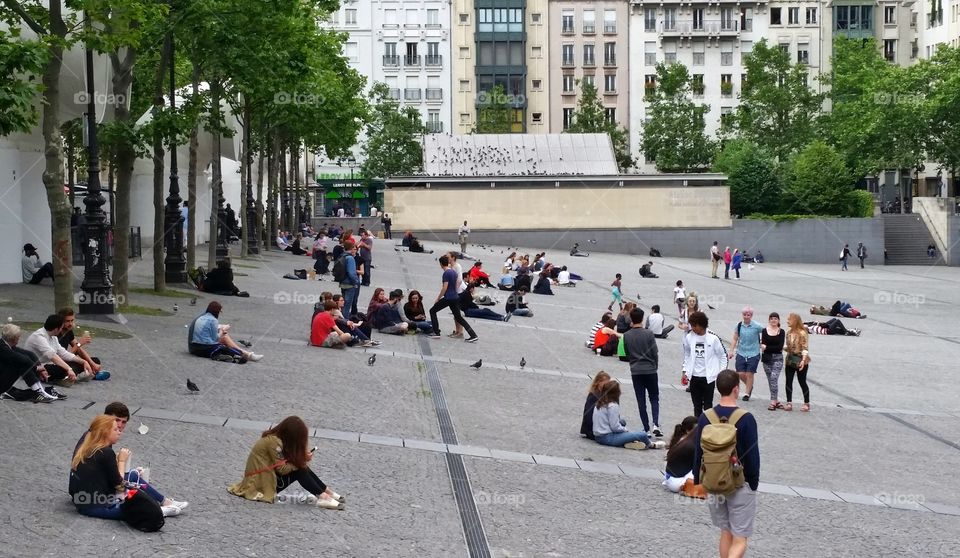 Youngsters are hanging out in front of Pompidou in Paris