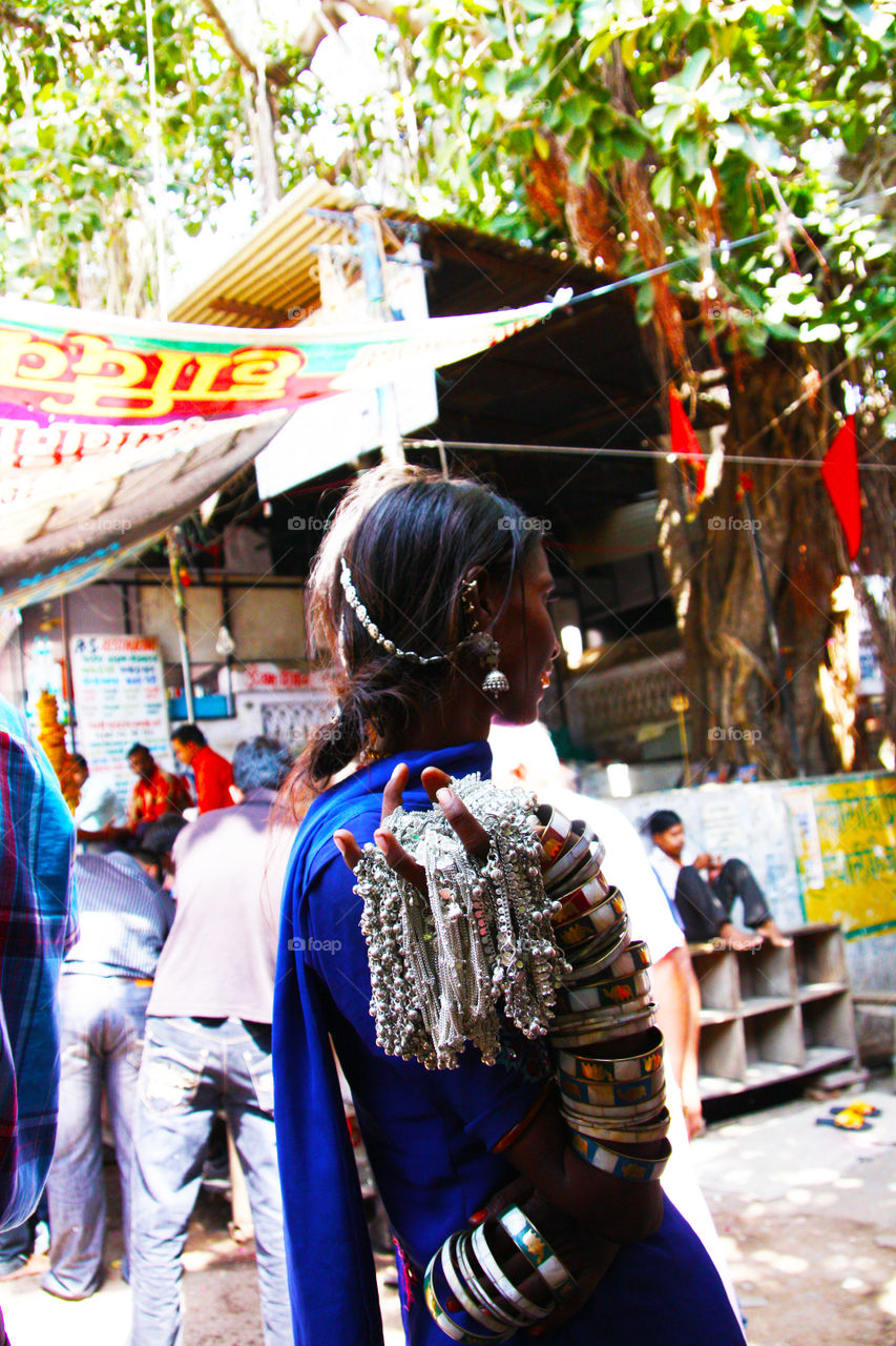 Girl in a little Indian market, retail.