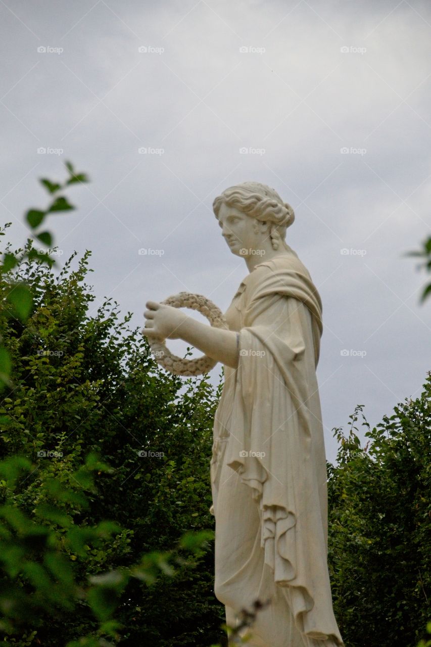 statue of a person in a garden