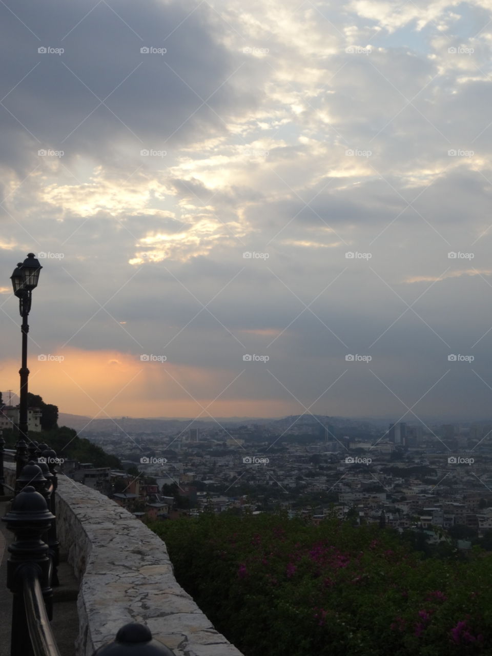 A cityscape of Guayaquil, Ecuador under a gorgeous sunset.