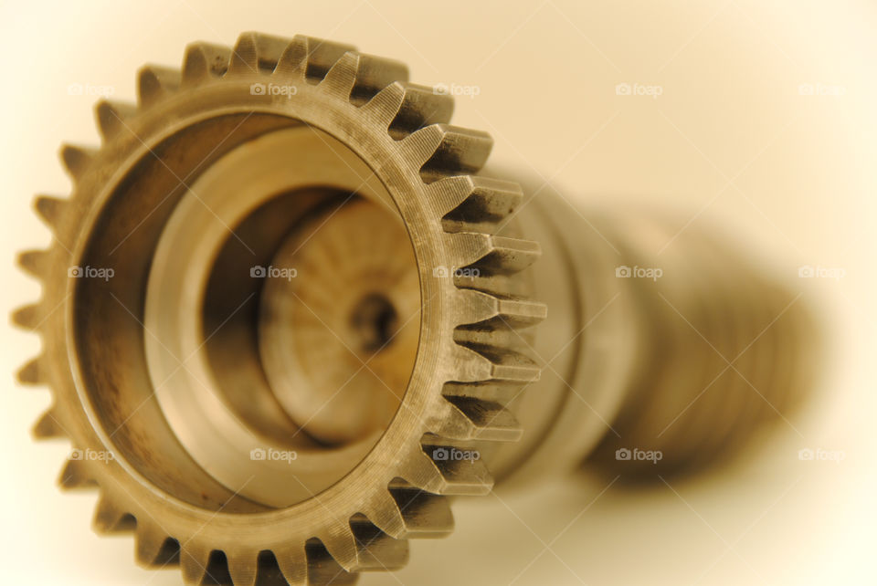 A pinion is a round gear used in several applications:

    usually the smaller gear in a gear drive train, although in the first commercially successful steam locomotive (the Salamanca), the pinion was rather large. In many cases, such as remote controlled toys, the pinion is also the drive gear.
    the smaller gear that drives in a 90-degree angle towards a crown gear in a differential drive.
    the small front sprocket on a chain driven motorcycle.
    the round gear that engages and drives a rack in a rack and pinion mechanism and against a rack in a rack railway.
    in the case of radio-controlled cars with an engine (i.e. nitro) this pinion gear can be referred to as a clutch bell when it is paired with a centrifugal clutch.