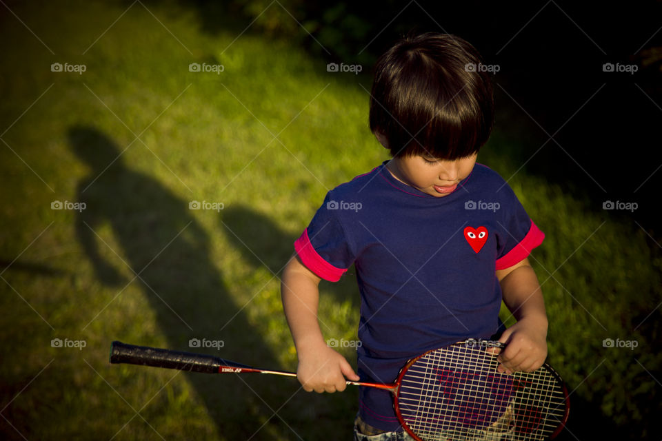 When spring comes it's time for outdoor sport and fun. kid playing in the garden