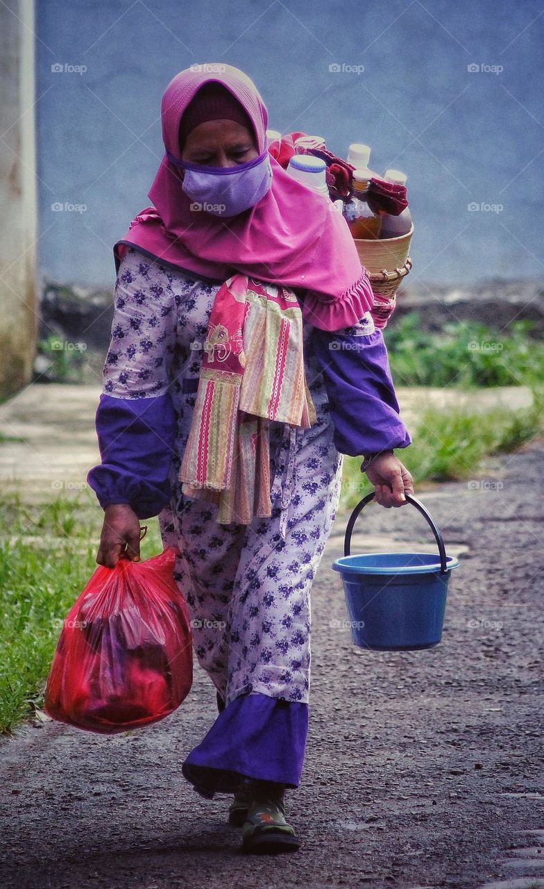 Itinerant traditional herbal medicine seller.