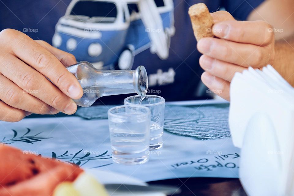 Liquid being poured in glasses 