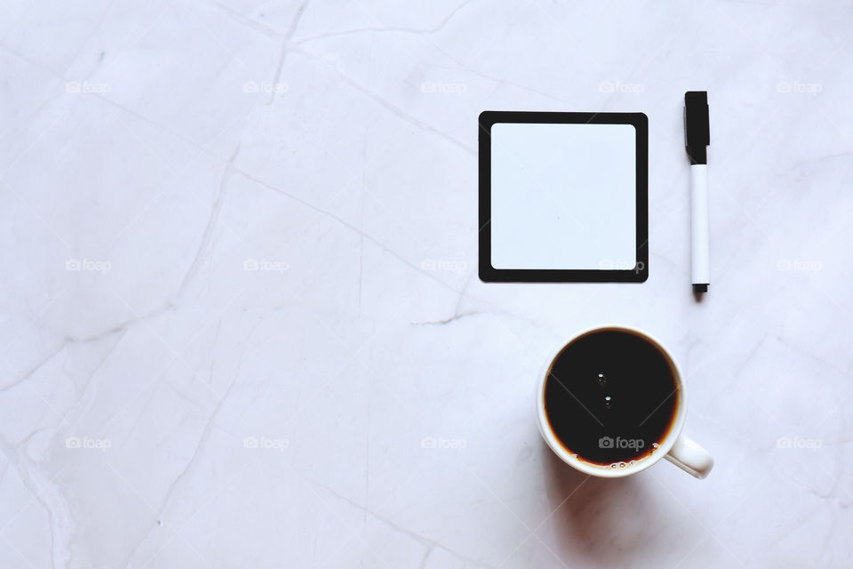 Business working morning with cup of hot coffee, sweet croissants, pen, notebook on white background close up. Top view, copy space, flat lay, mockup.