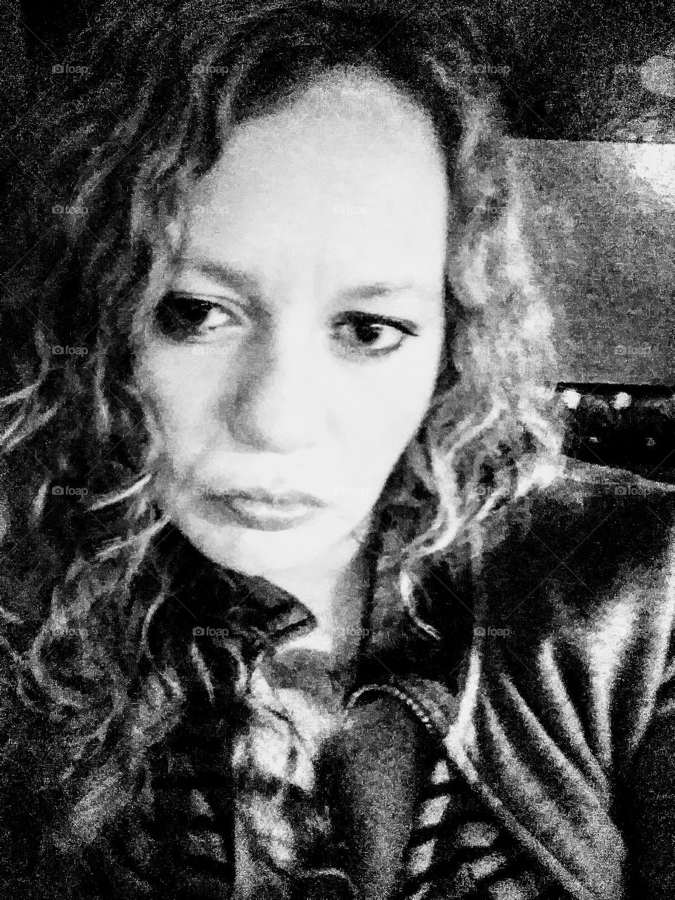 Curly haired chick looking exasperated because of a man.