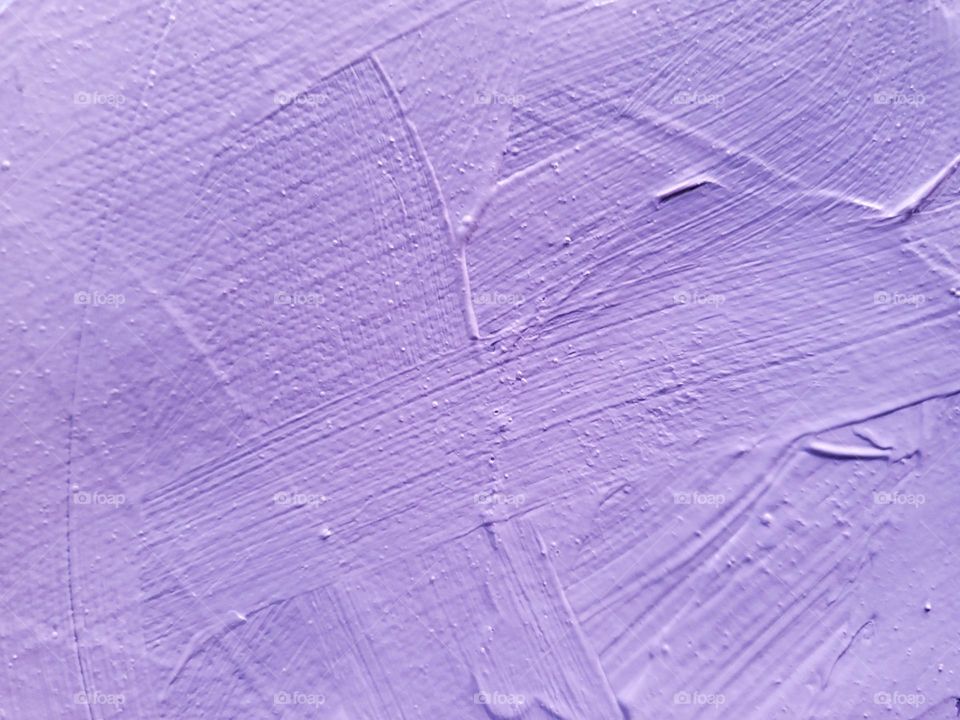 Acrylic pastel lavender color paint brush strokes on a canvas.