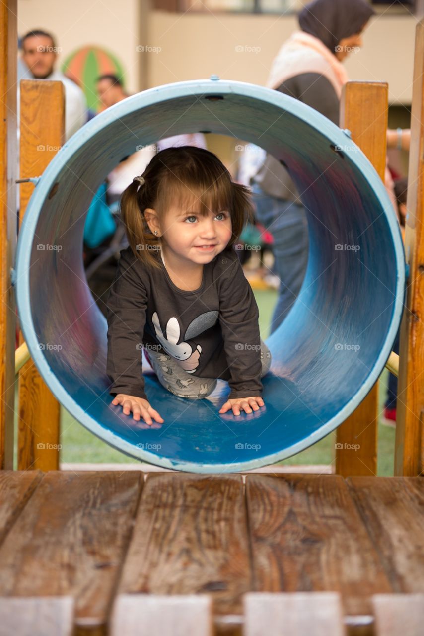 baby girl playing in the playground