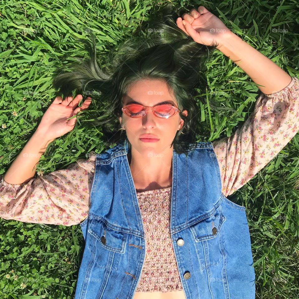 Laying in the grass as green as my hair