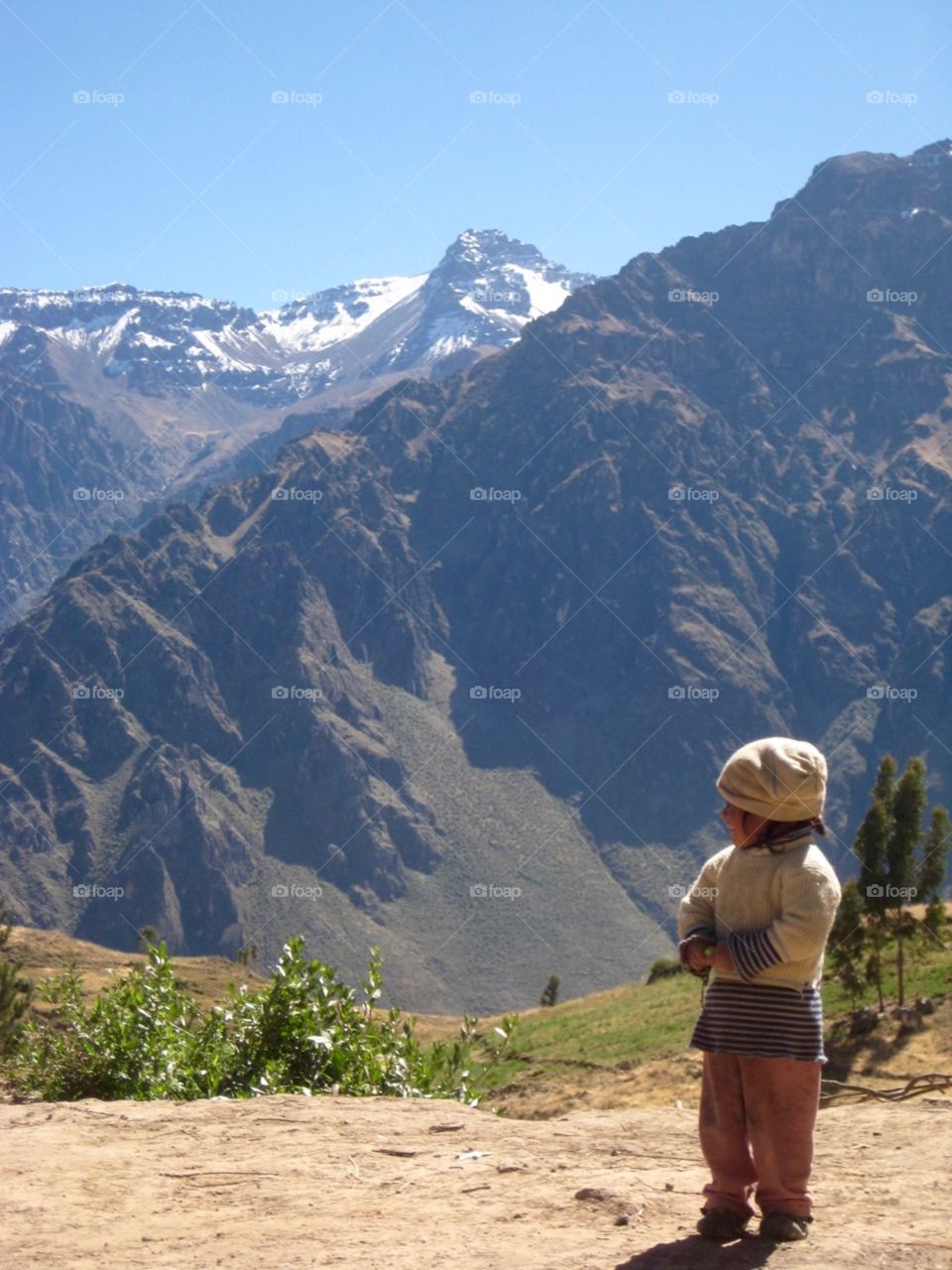 Peru mountains with small child 
