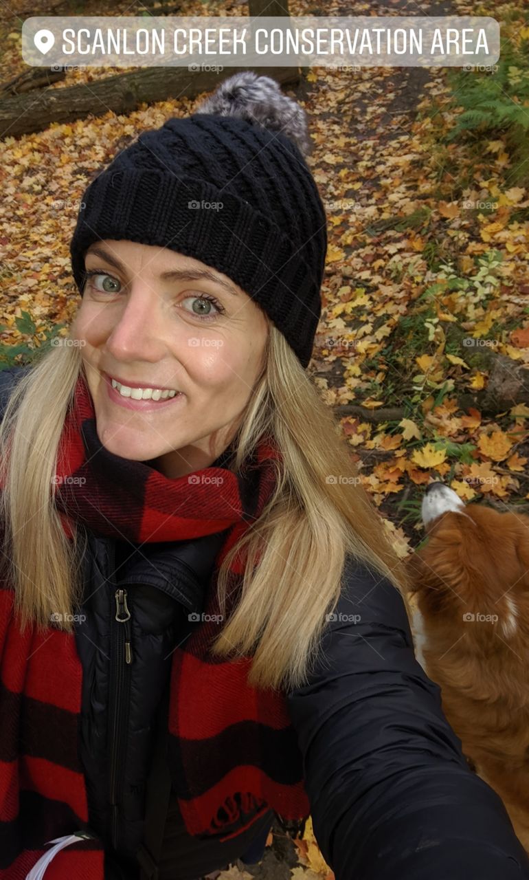 selfie of woman and her dog during fall