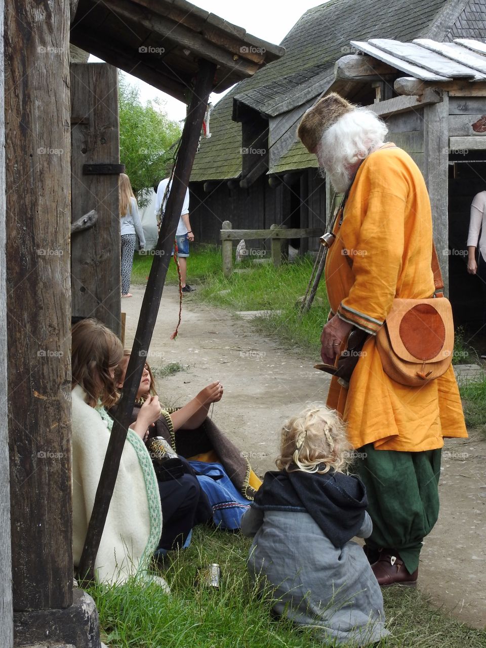 Old man teaching the kids