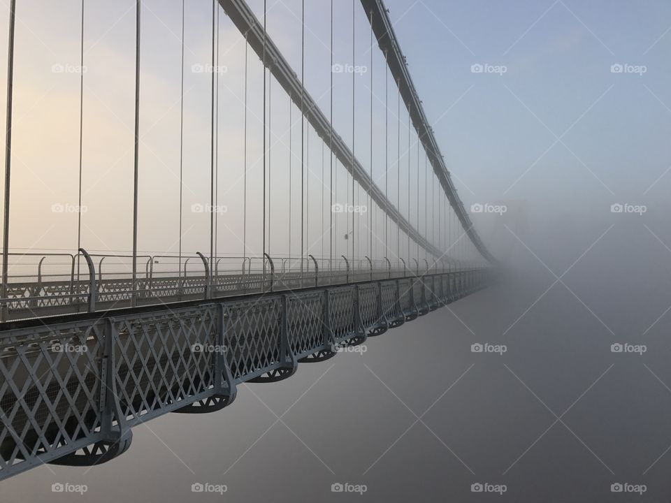 Operated since 1864, the Clifton Suspension Bridge spans the Avon Gorge and the River Avon, linking Clifton in Bristol to Leigh Woods in North Somerset. At 300 feet above the river, early morning fog lends its mystic to this engineering beauty.  #Suspension #Bridge #Bristol 