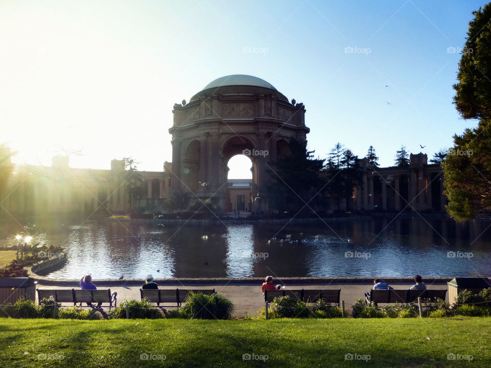 Palace of fine arts, San Francisco, people relaxing, sitting on a bench