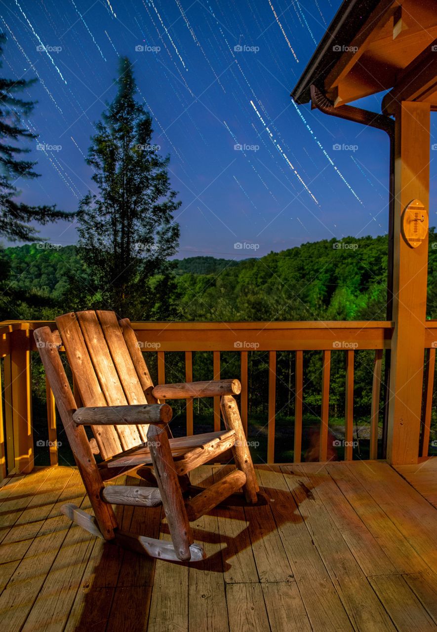 Star Trails and a Rocking Chair in a porch in the Mountains 