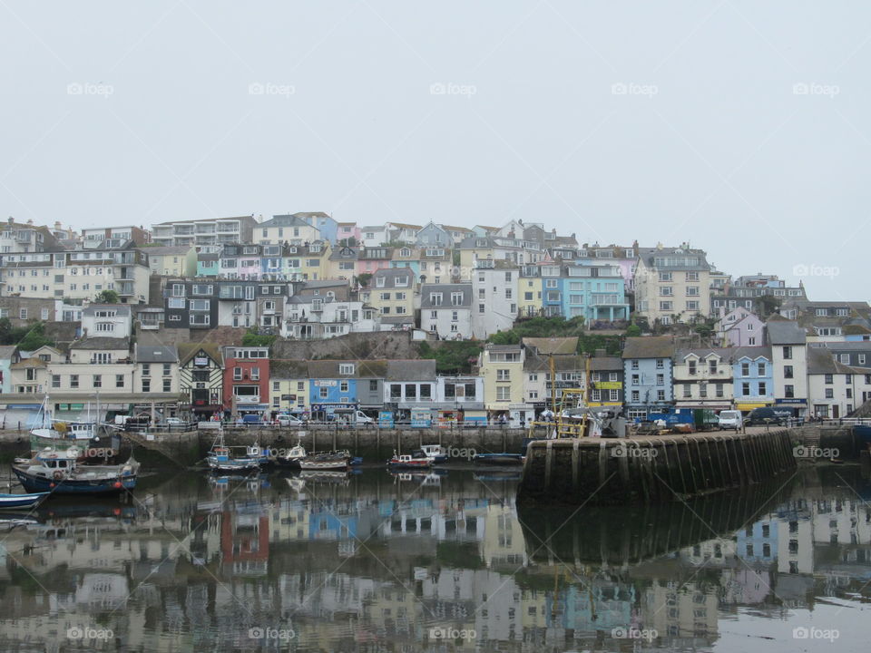 Brixham harbour with reflection on sea from the buildings. Brixham is a seaside situated in Devon uk