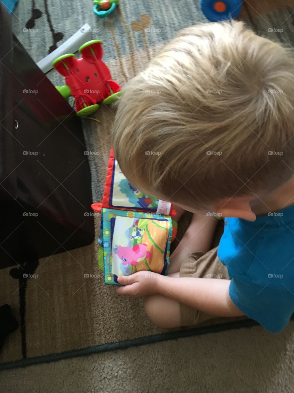 Toy book and a boy 