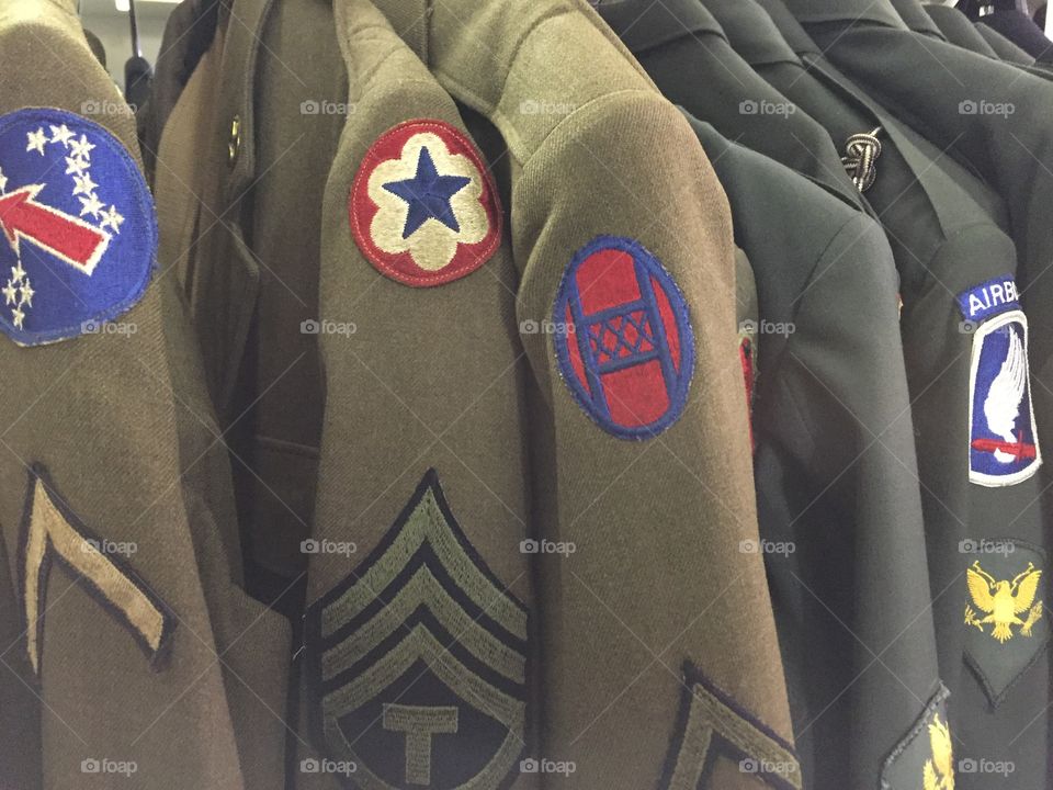 Military Clothing hanging on hangers