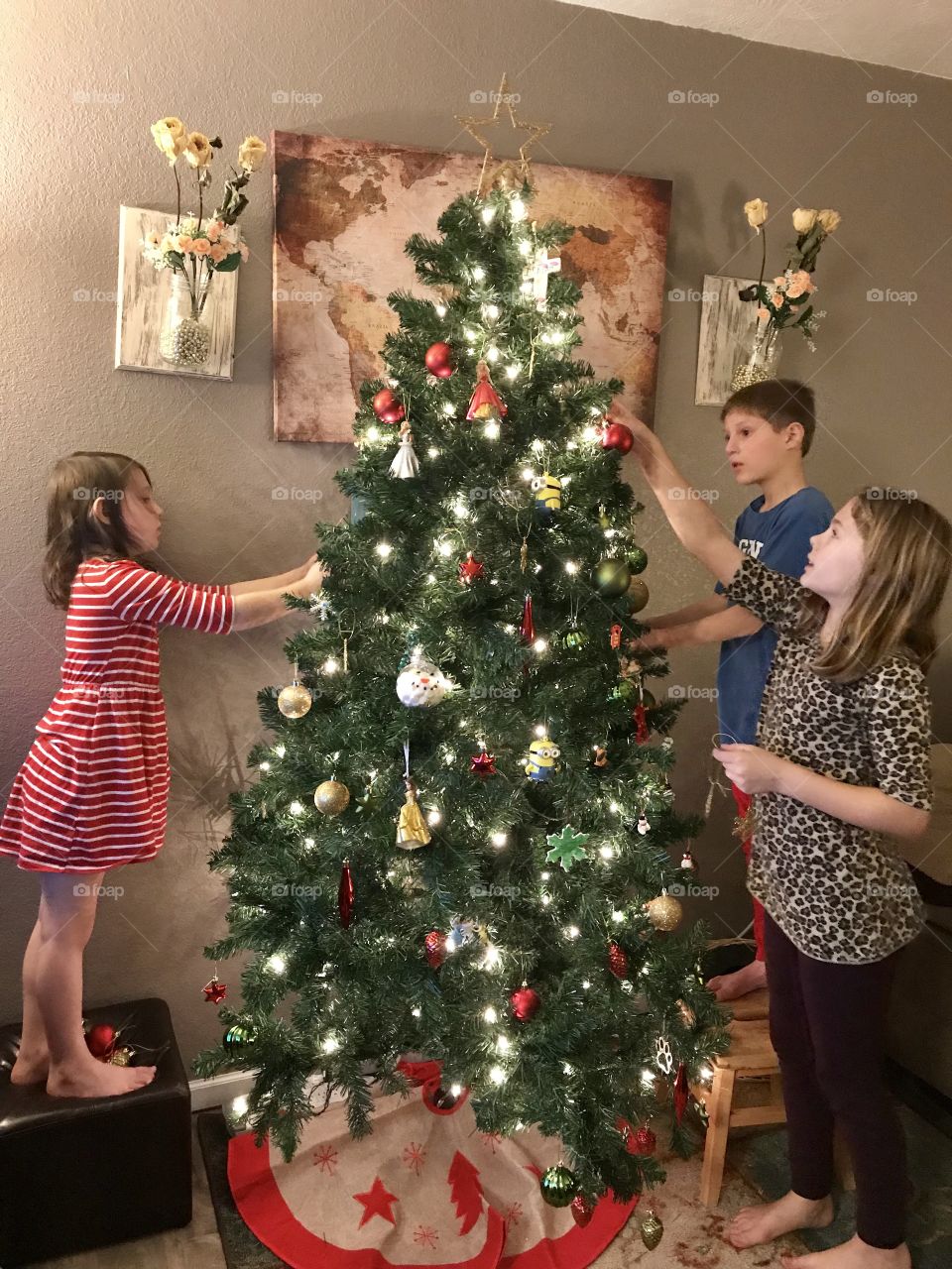 Decorating the Christmas tree with the kids.