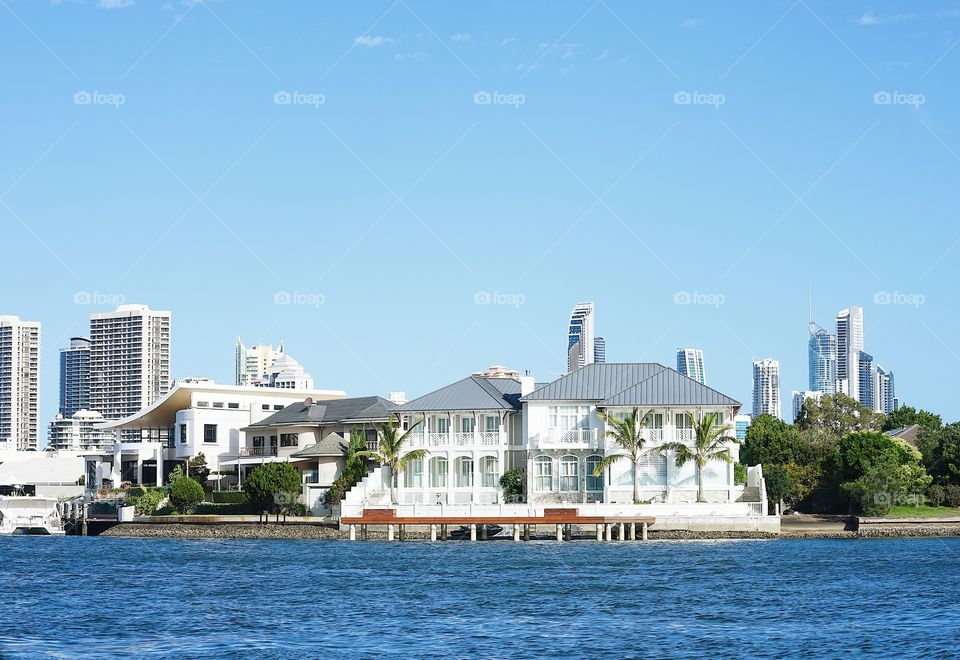 Mansion by the seaside. Luxury homes along the coast line in Queensland, Australia. These beautiful expensive homes belong to the upper class millionaire family.