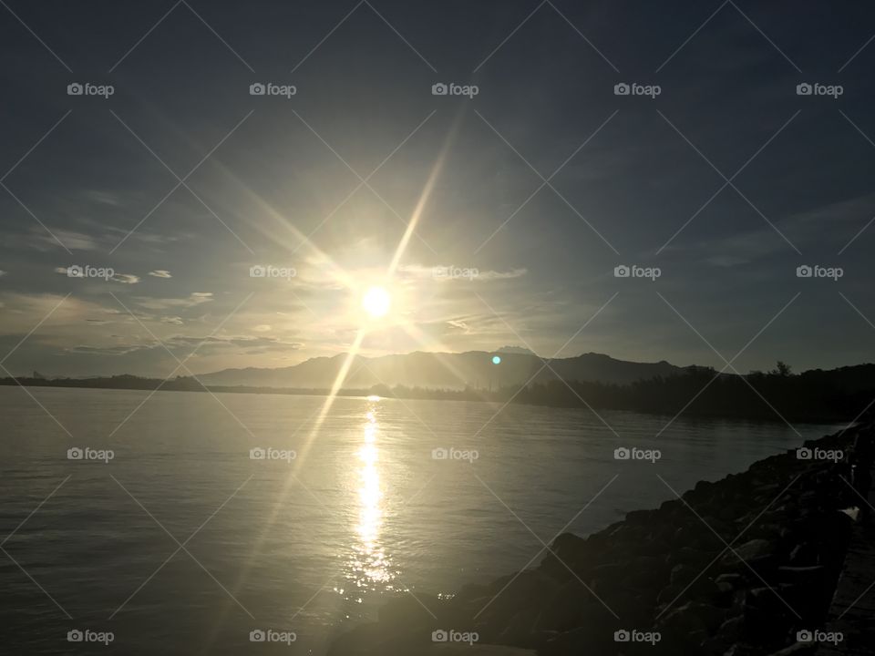 Sunrise, mountain and water