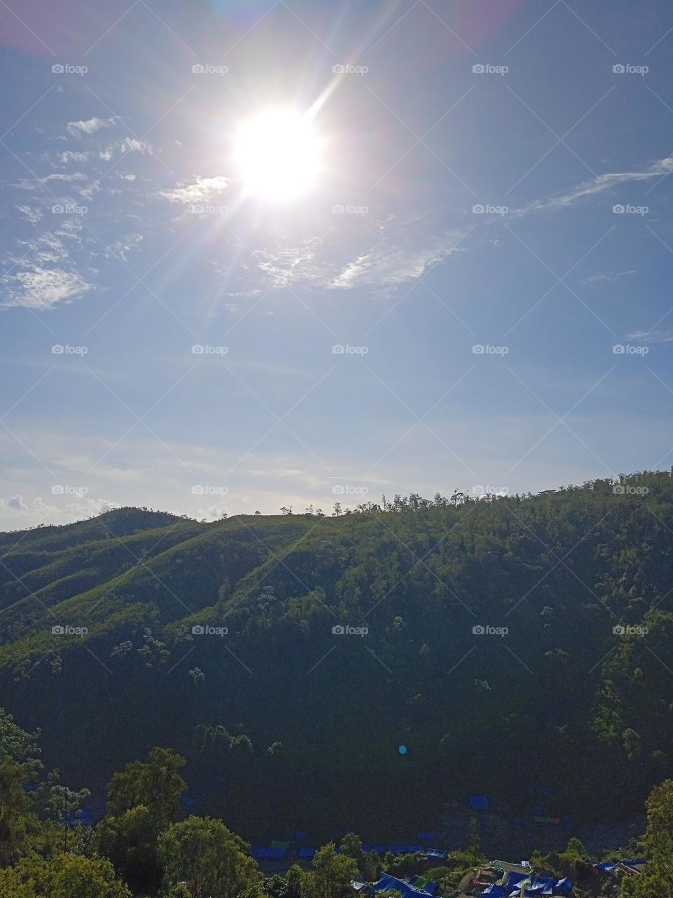 The hot sun on a mountain at a people's gold mining site in the eastern part of Indonesia.