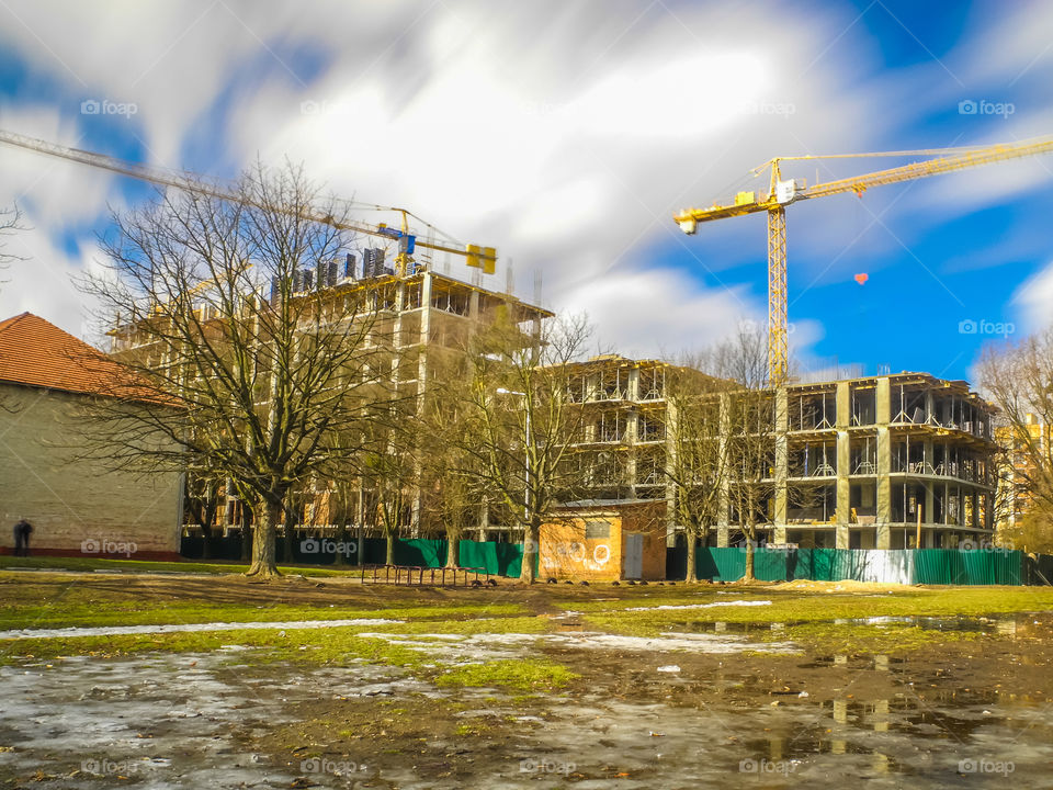 building process with crane on long exposure