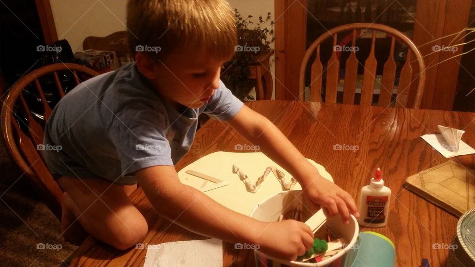 Boy creating craft