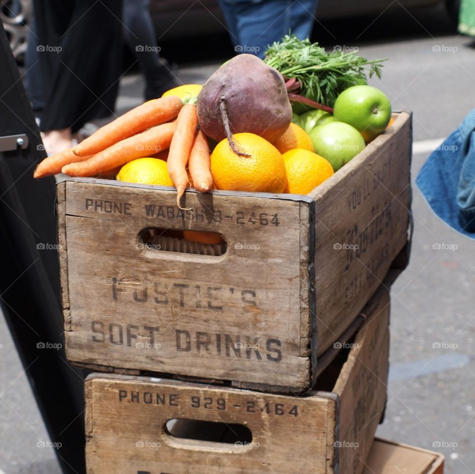 Colourful fruit and veg in a vintage wooden crate
