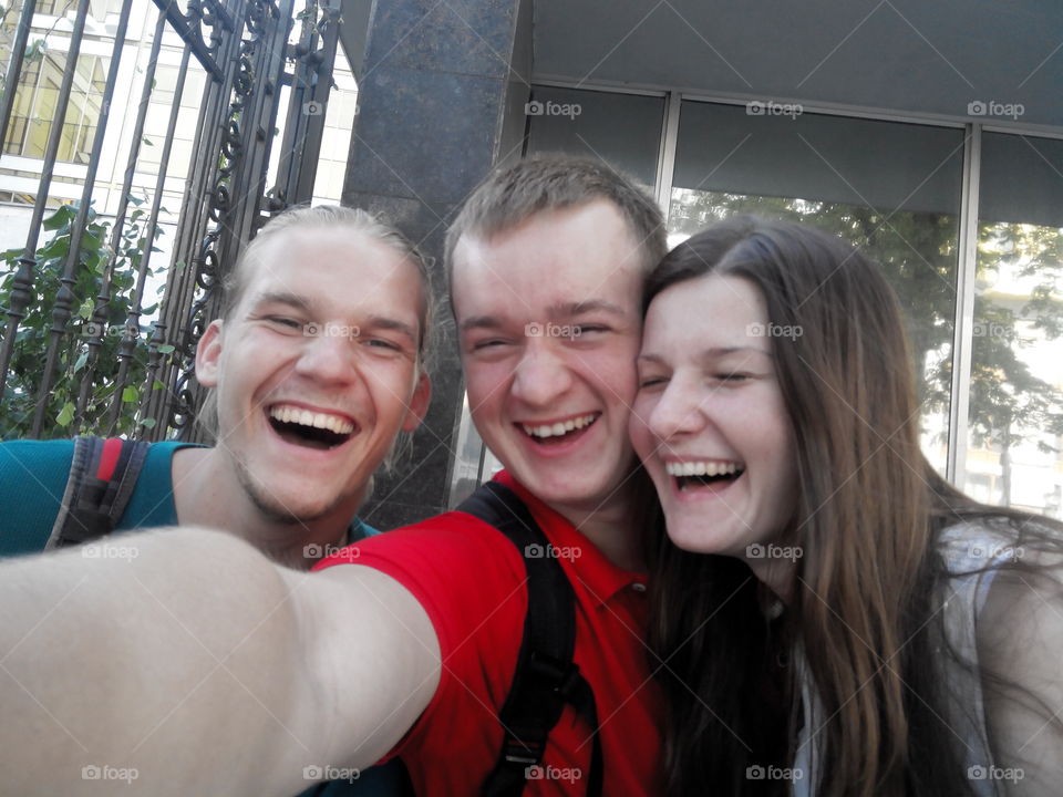 three friends smile. kiev Ukraine