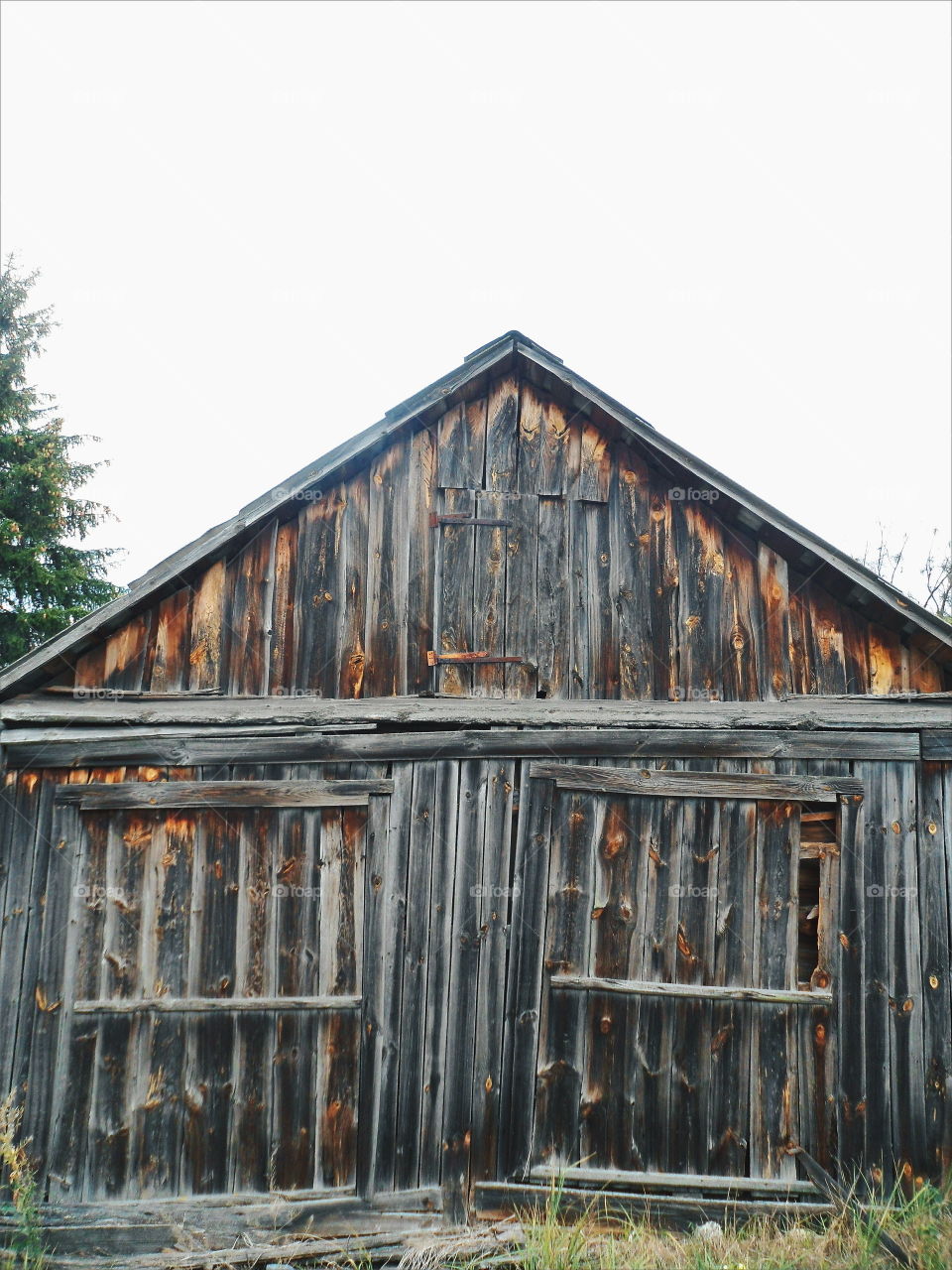 old wooden barn in the village of Zhukin, Kiev region