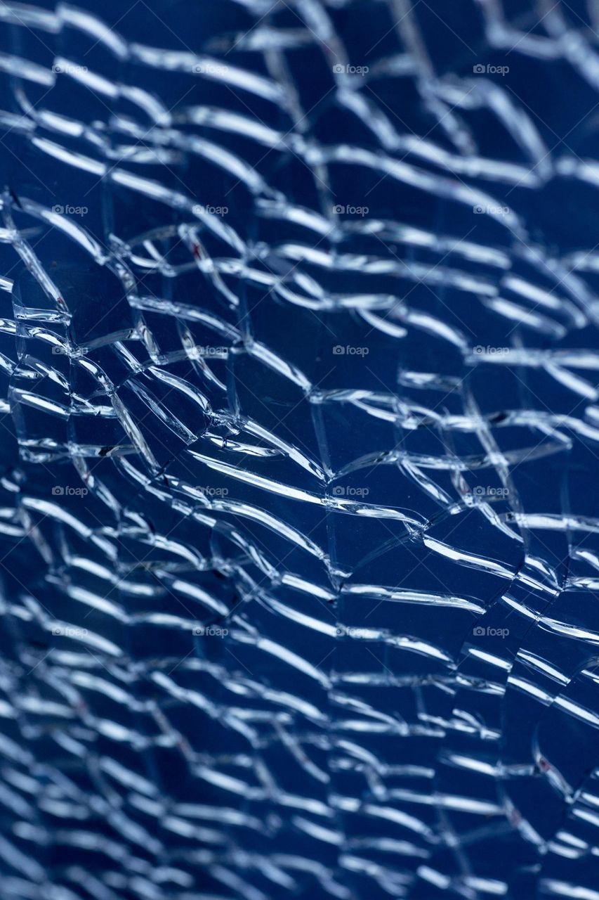 Blue cracked window glass damage situation be careful abstract background
