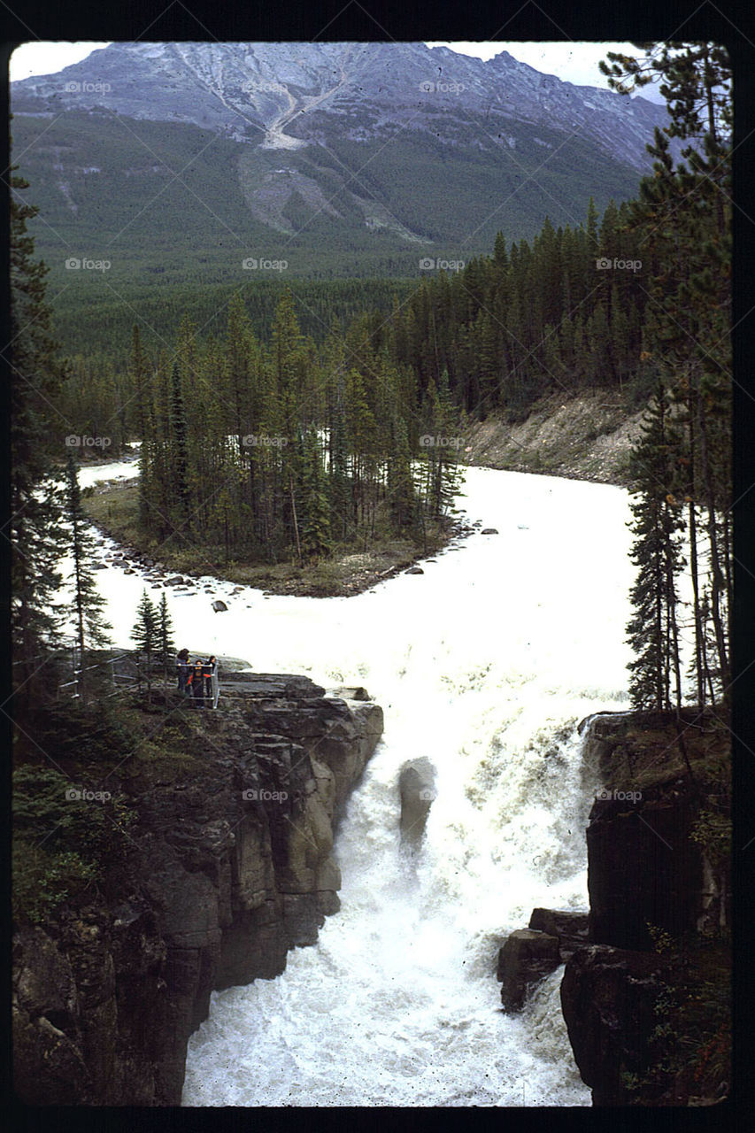 Island in river near waterfall