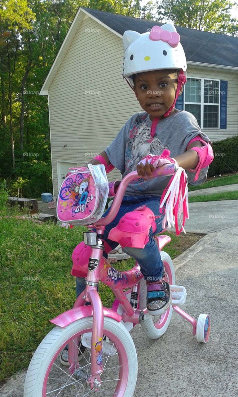 My Lyric. My Lyric with her new bike and safety gear for doing great in school for the last month. Good job Lyric! 