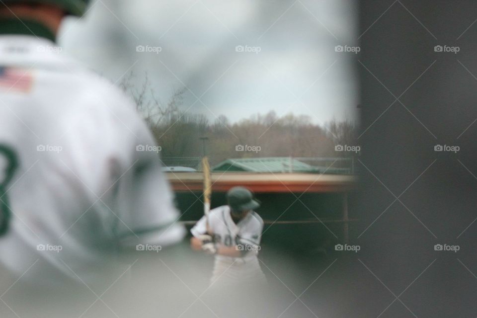 Baseball through the fence