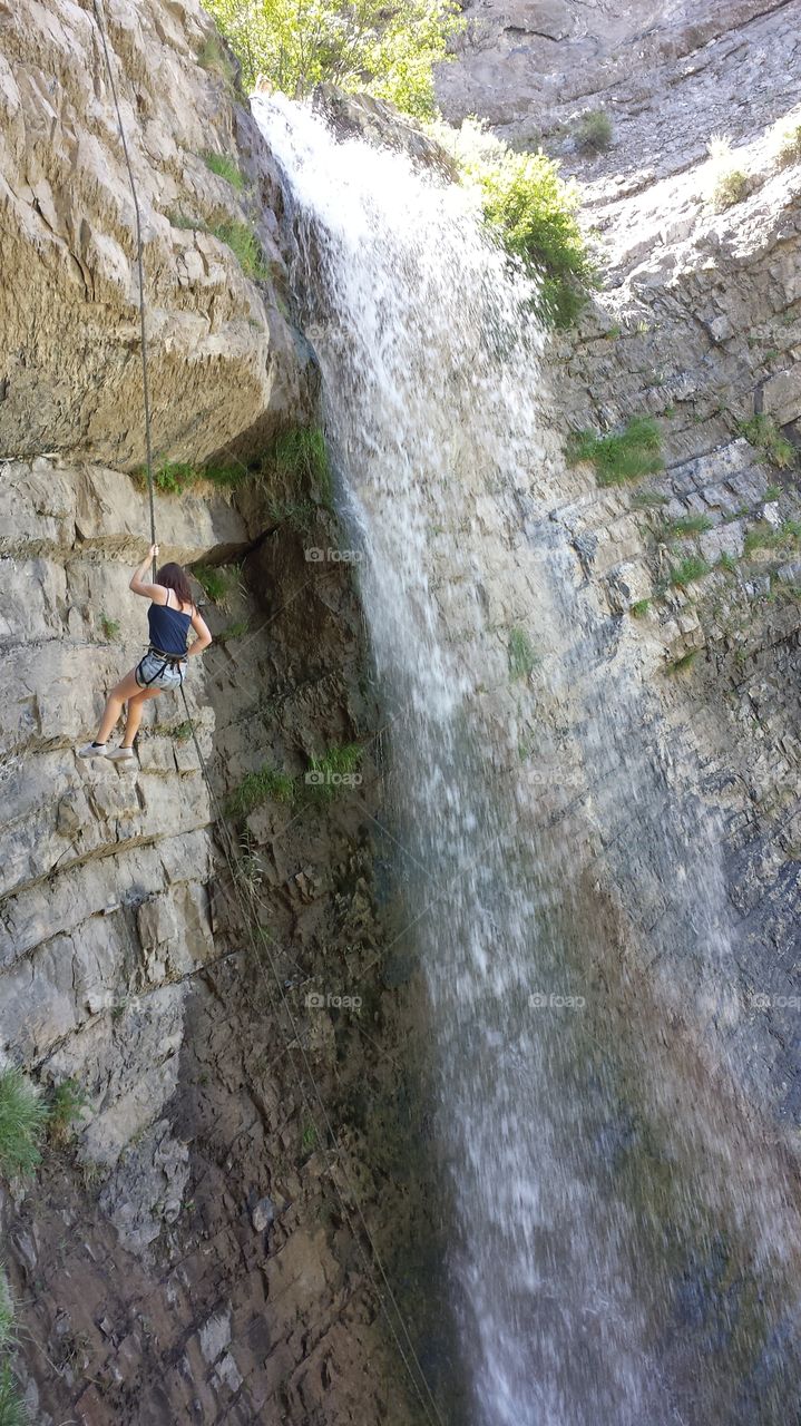 Waterfall Rappelling. Rappelling at the waterfall in Battlecreek Canyon on Mount Timpanogas near Pleasant Grove, Utah.