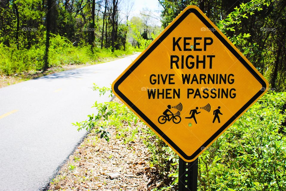 Sign on bike trail