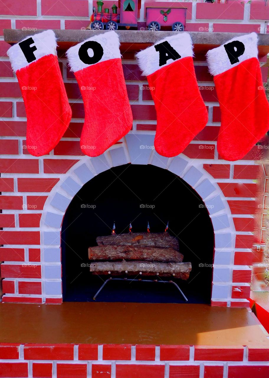 Christmas stocking hanging near fireplace
