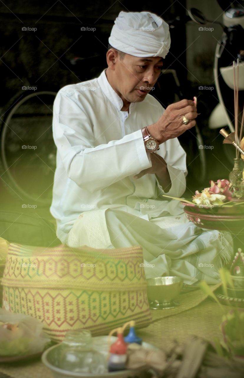 Balinese Man praying 