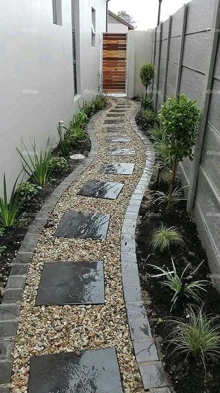 The image embodies a natural natural plate of the mountains of nature, where green agricultural stands are graded on the slopes as if they were lines of a poem, which fog harmoniously wrapped, and clouds hugged them in the mountain knife and the whis