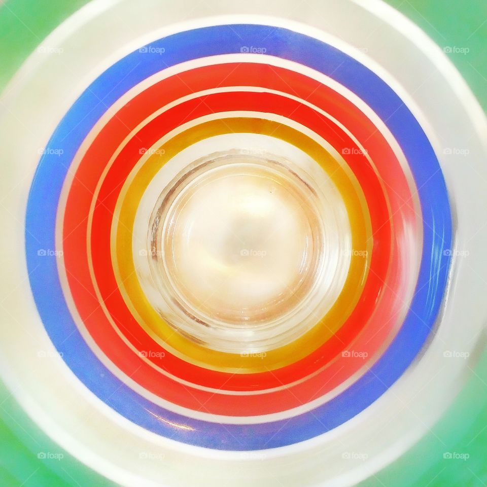 Looking inside a water glass with horizontal stripes on the outside