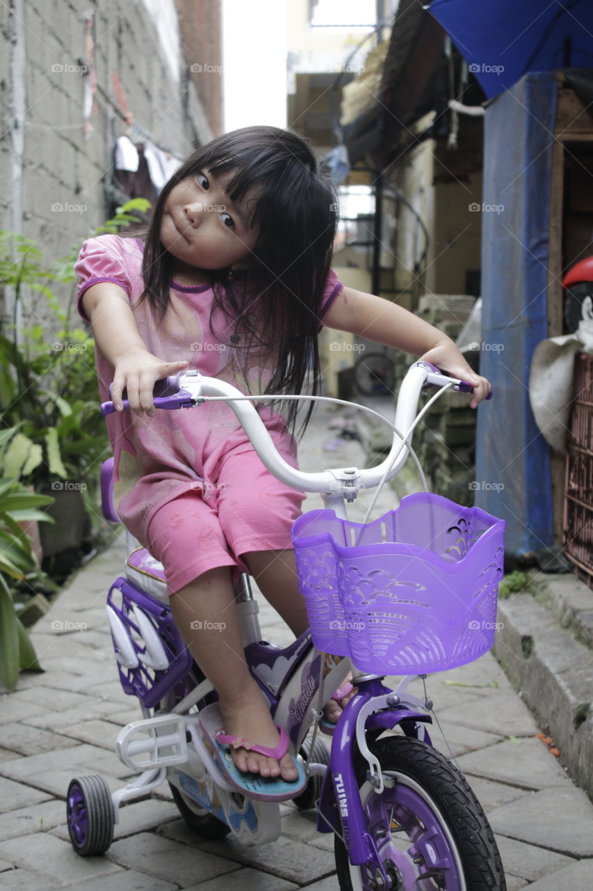 Cute girl riding bicycle