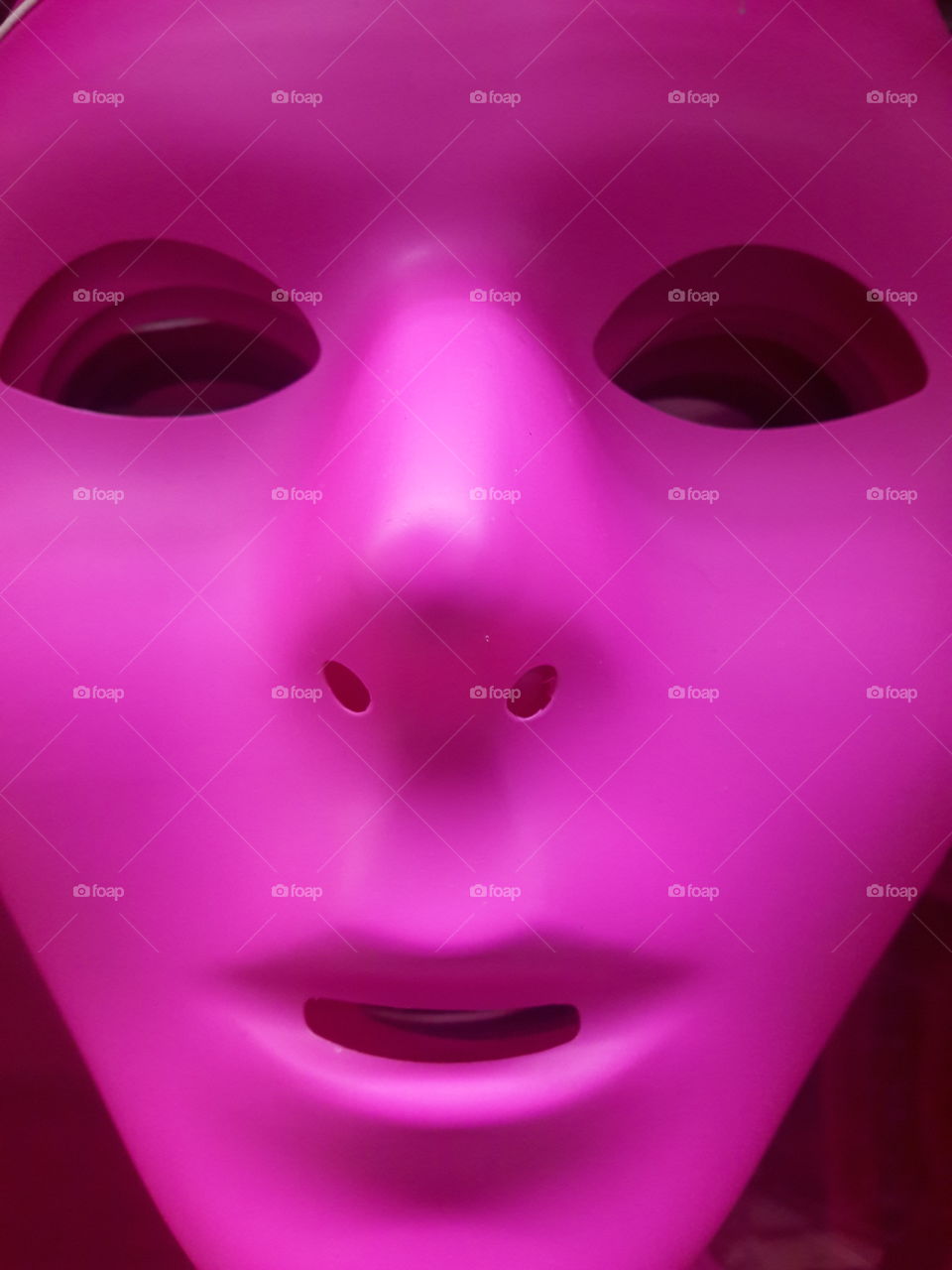 Close-up of pink plastic mask