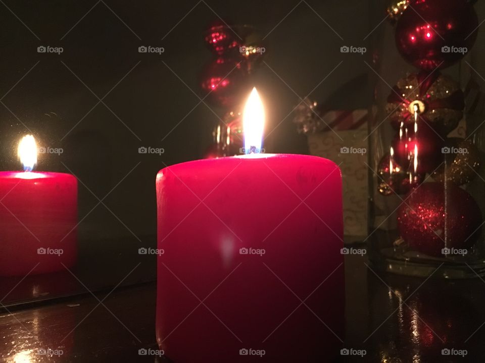 Red candle on mantel at Christmas 
