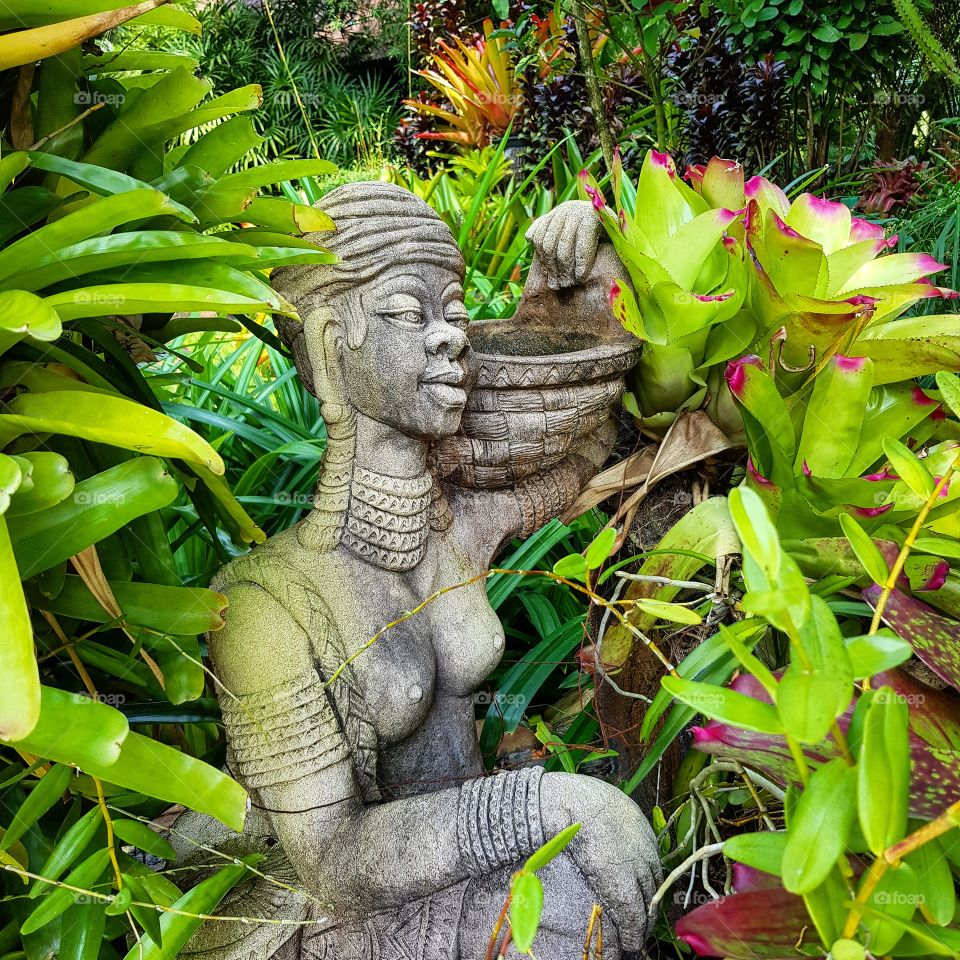 The statue and plants for garden arrangement
