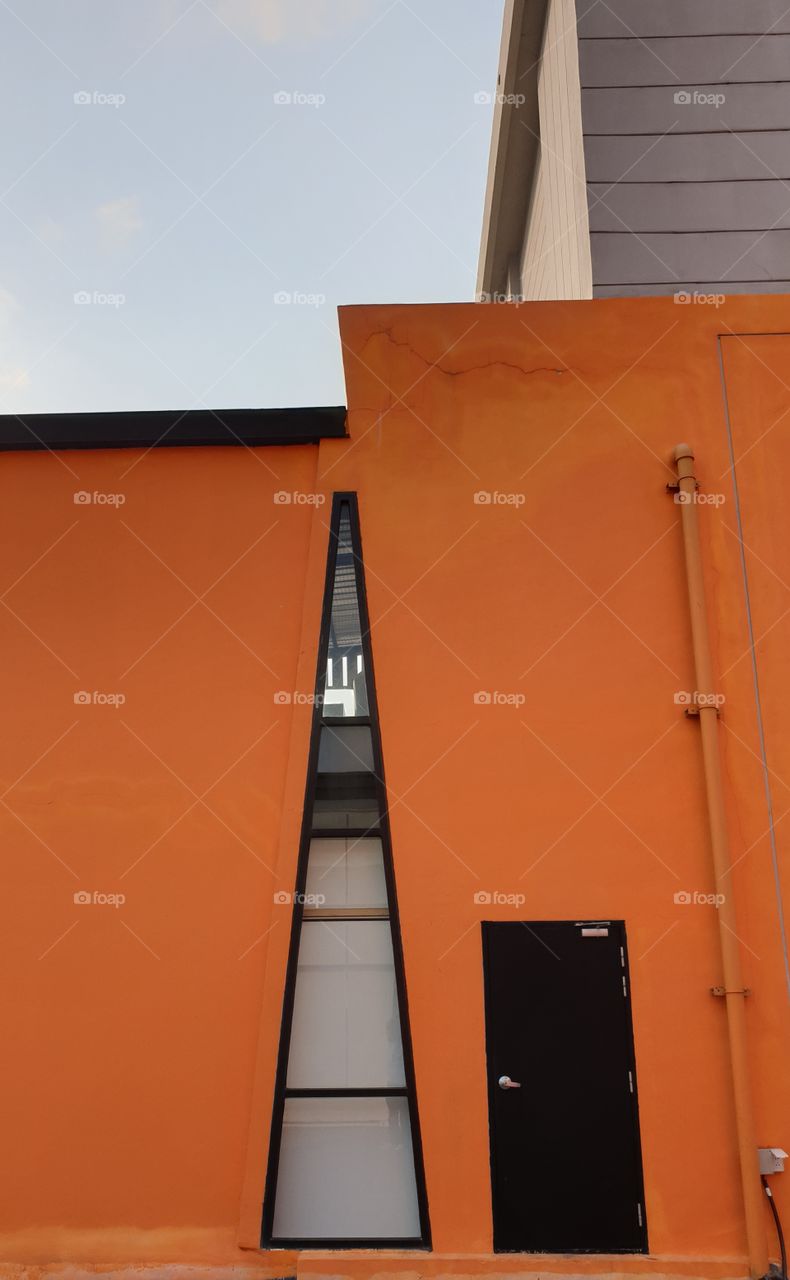 The Orange Wall At Blue Sky.