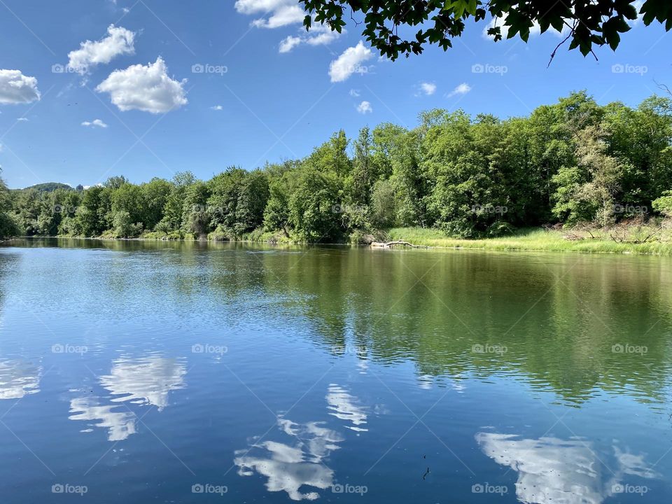 water landscape grass and clouds