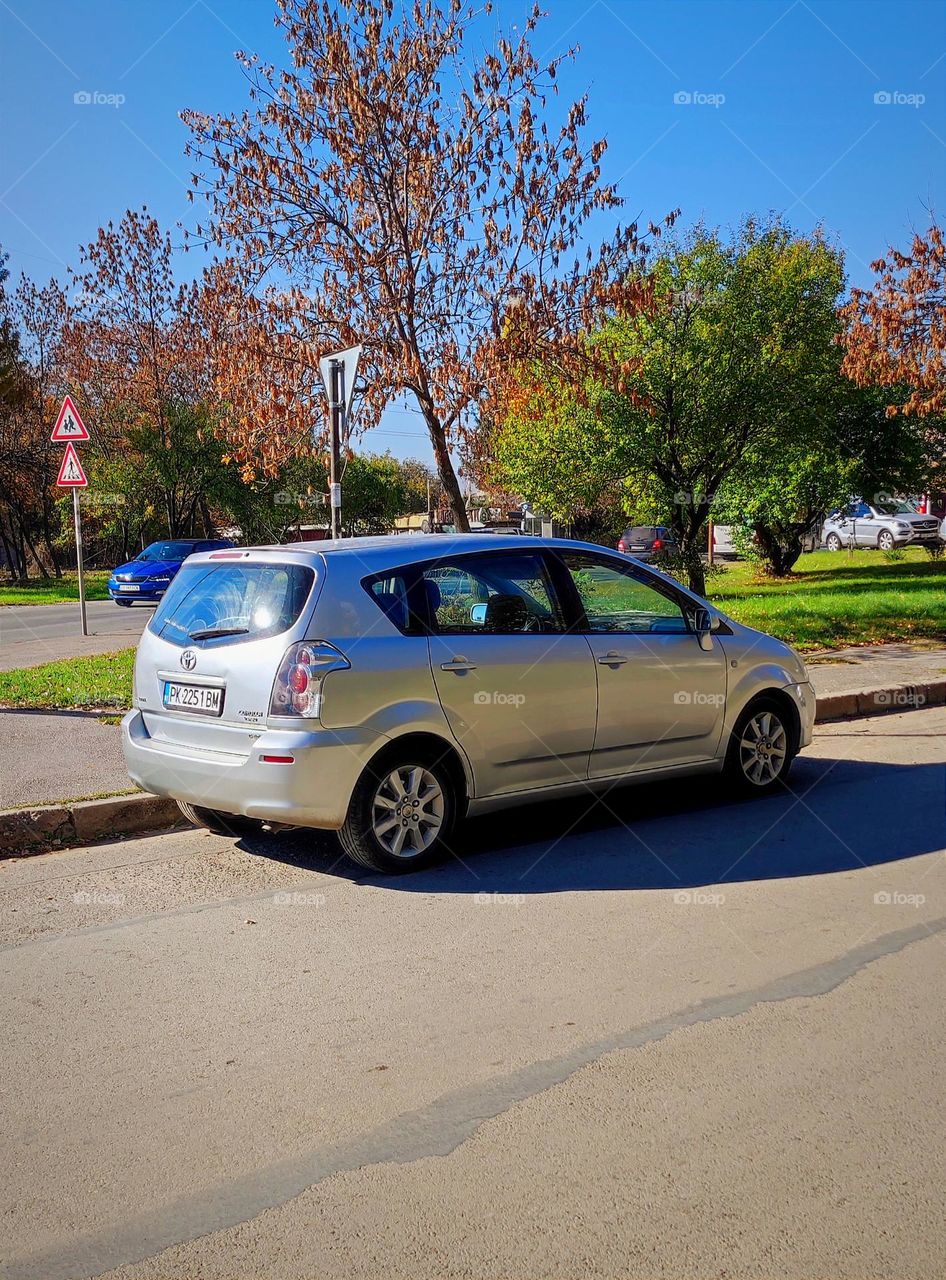 Older Toyota Corolla in the autumn / An ordinary car / Car for everyday use / Normal Toyota car